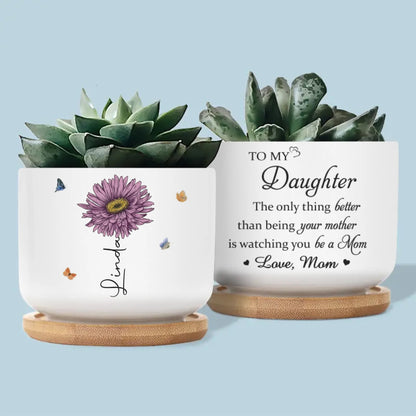 Her Love Blooms In Every Season - Family Personalized Custom Home Decor Ceramic Plant Pot, The Only Thing Better Than Being Your Mother is Watching You Be A Mom Personalized Birth Flower Plant Pot TD0030